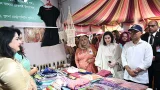 পুনাক স্টল উদ্বোধন শেষে তার সহধর্মিণী ডা. জোবাইদা রহমানকে নিয়ে স্টল পরিদর্শন করেন প্রধানমন্ত্রী তারেক রহমান।